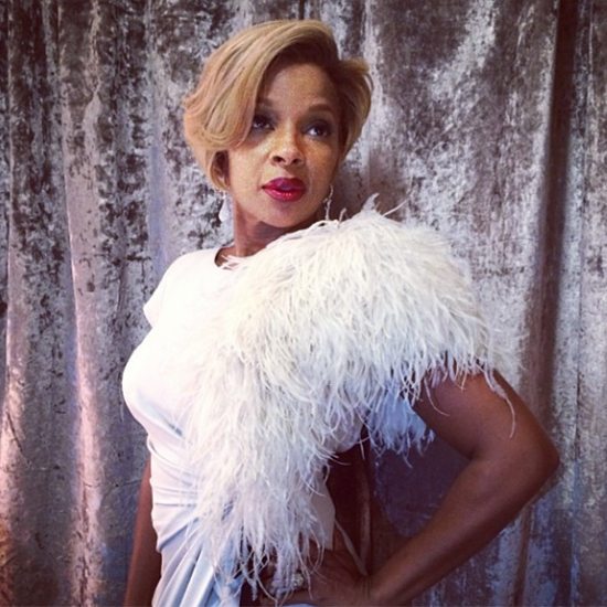 Mary J Blige In White In Front Of SIlver Curtain