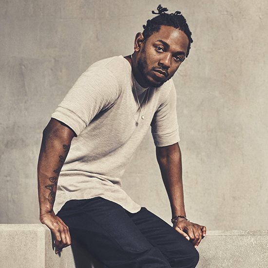 Kendrick Lamar Sitting In Tan Shirt With Black Pants