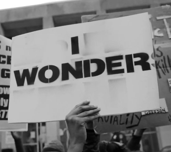 louis-york-nerds-lyric-video-still-protest-sign