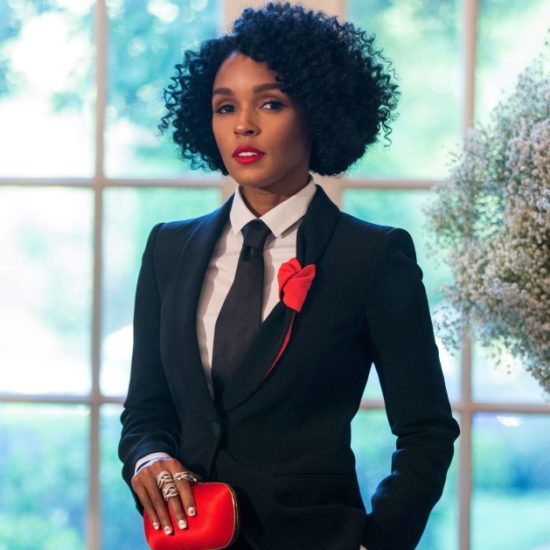 Janelle-Monae-Black-Suit-Red-Purse